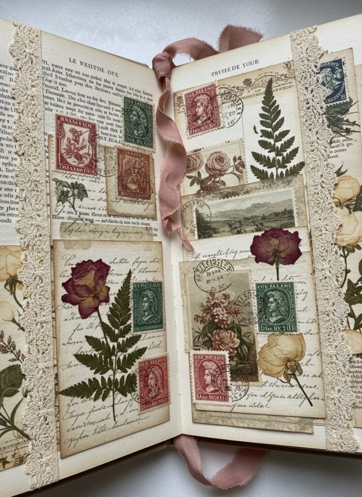 Vintage junk journal spread showing layered ephemera, old papers, stamps, and decorative elements demonstrating junk journaling aesthetic