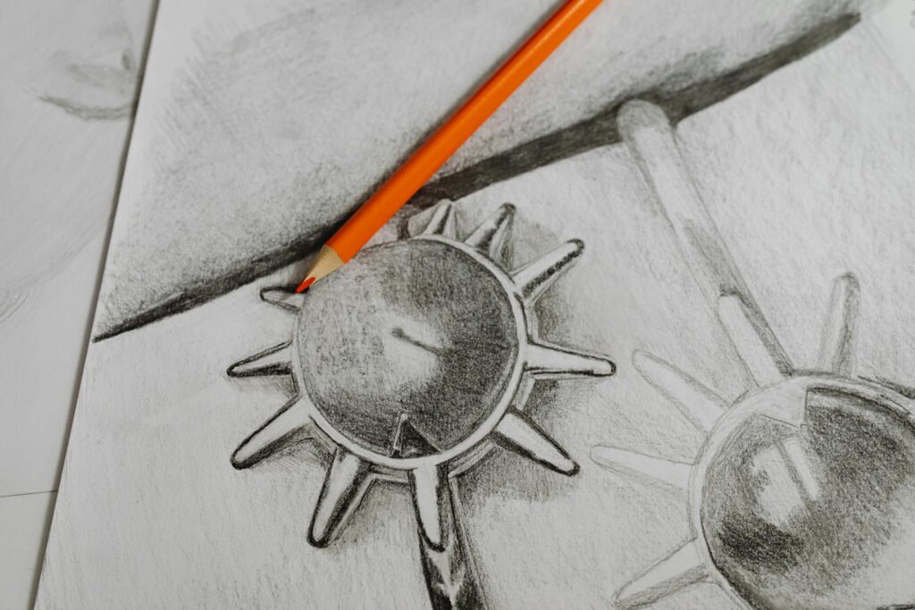 Detailed close-up of a pencil sketch with an orange pencil on top, creating a creative art piece.