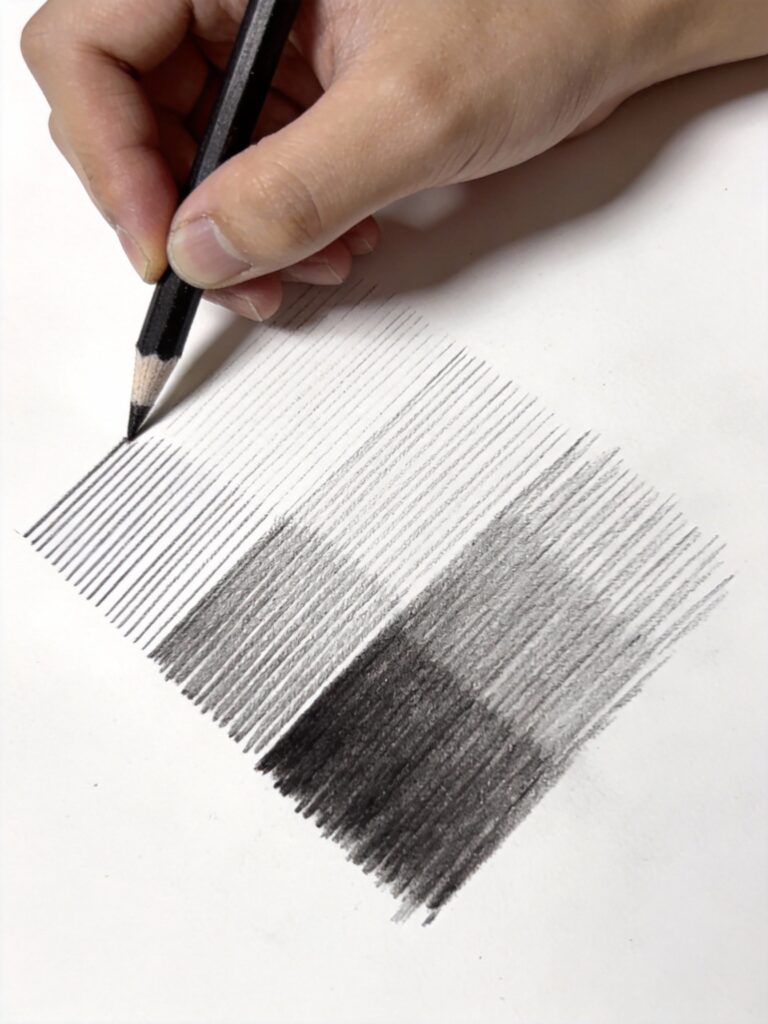 Hatching shading technique demonstration showing parallel pencil lines spaced at different intervals creating gradual value transitions