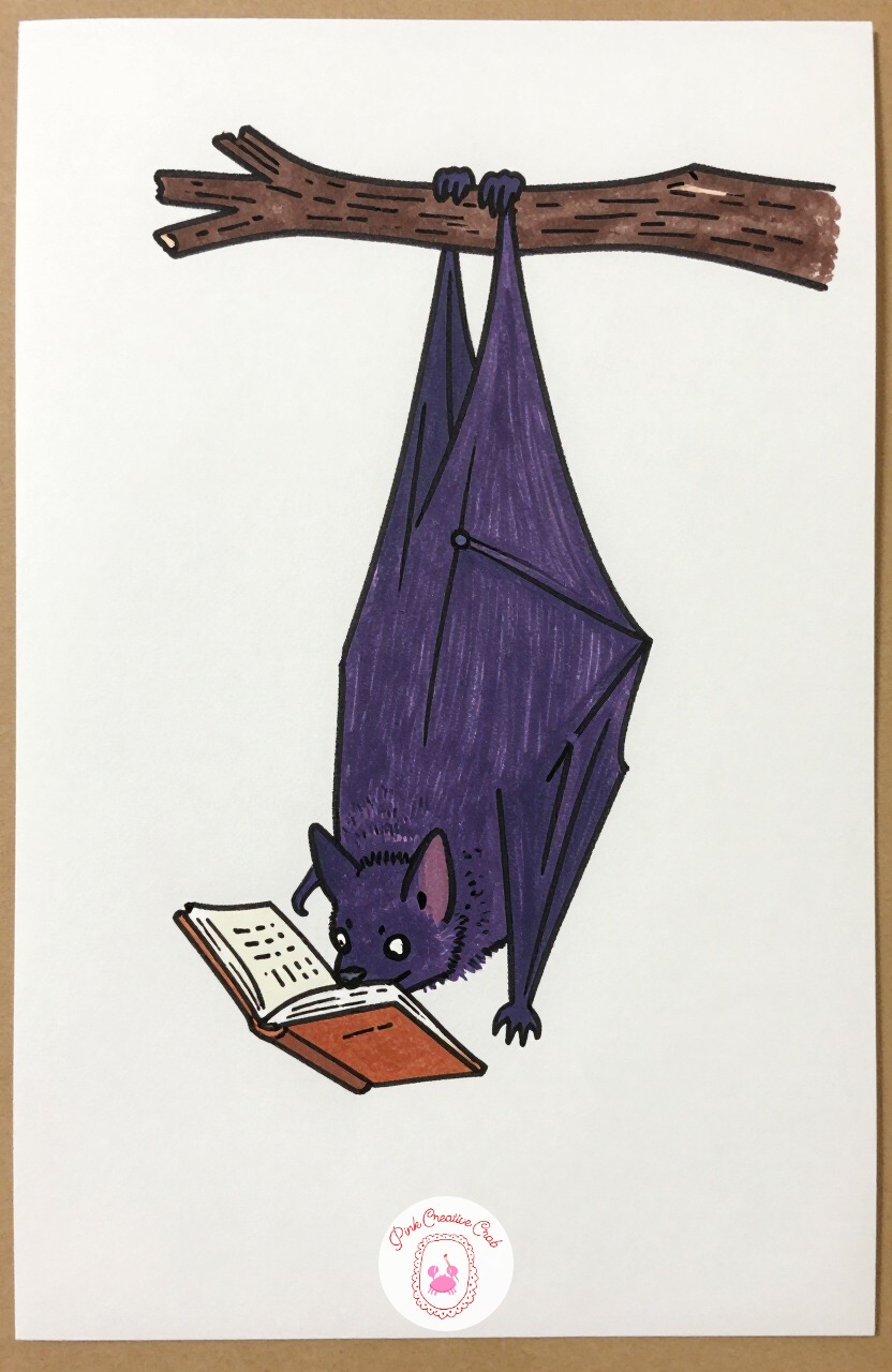 Bat Hanging Upside Down Reading a Book — Draw the bat hanging upside down from a branch, wings folded close to the body, and a tiny open book held up in one