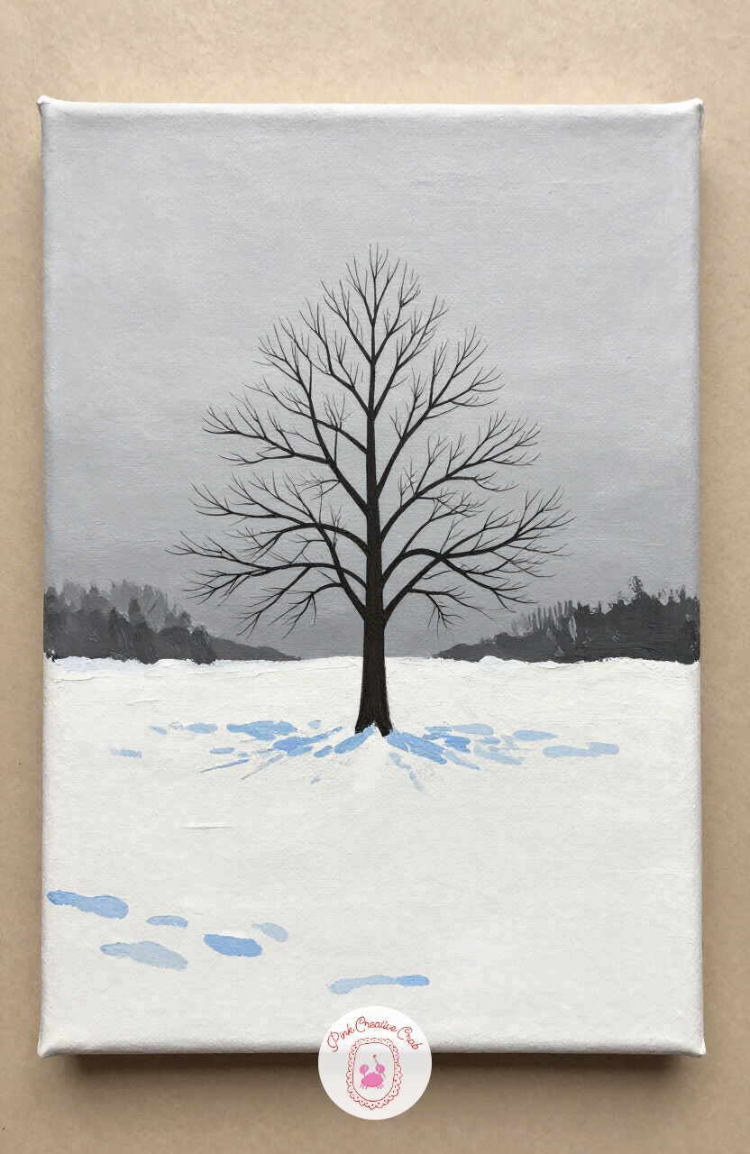 Lone Tree In A Snowy Field — One bare or snow dusted tree in an open field is one of the simplest christmas painting ideas to compose, since there is only one