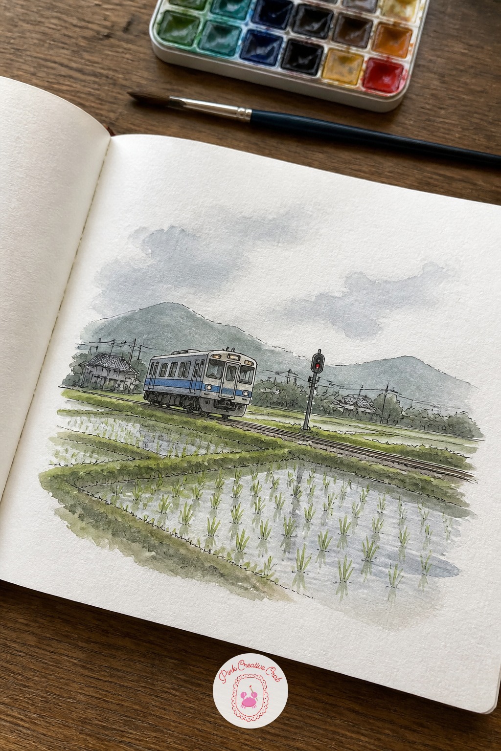 One-Car Local Train Passing Rice Fields — This scene is where a beginner usually makes the train look flat, so let's fix that early. Japan sketchbook