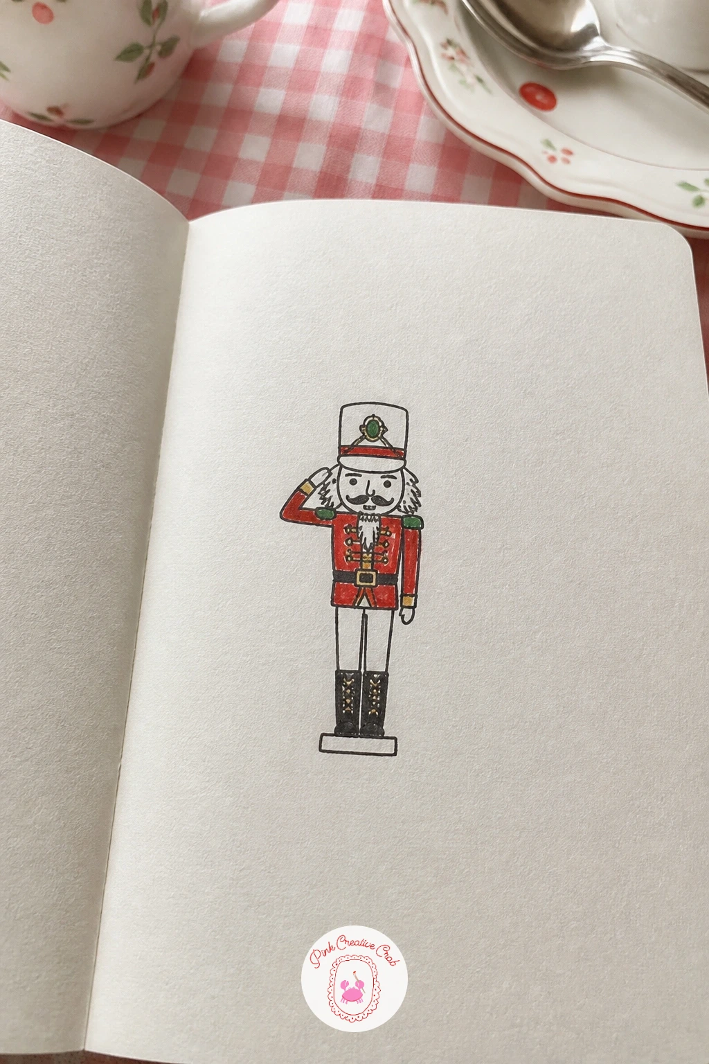 Nutcracker Saluting — Keep the character energy going with a nutcracker saluting, a slightly more structured figure than the gingerbread man. Christmas card