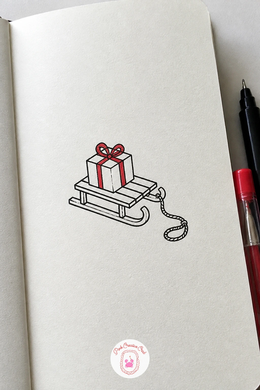 Sled With A Gift — Give the page a sense of motion with a small wooden sled. Simple christmas doodles