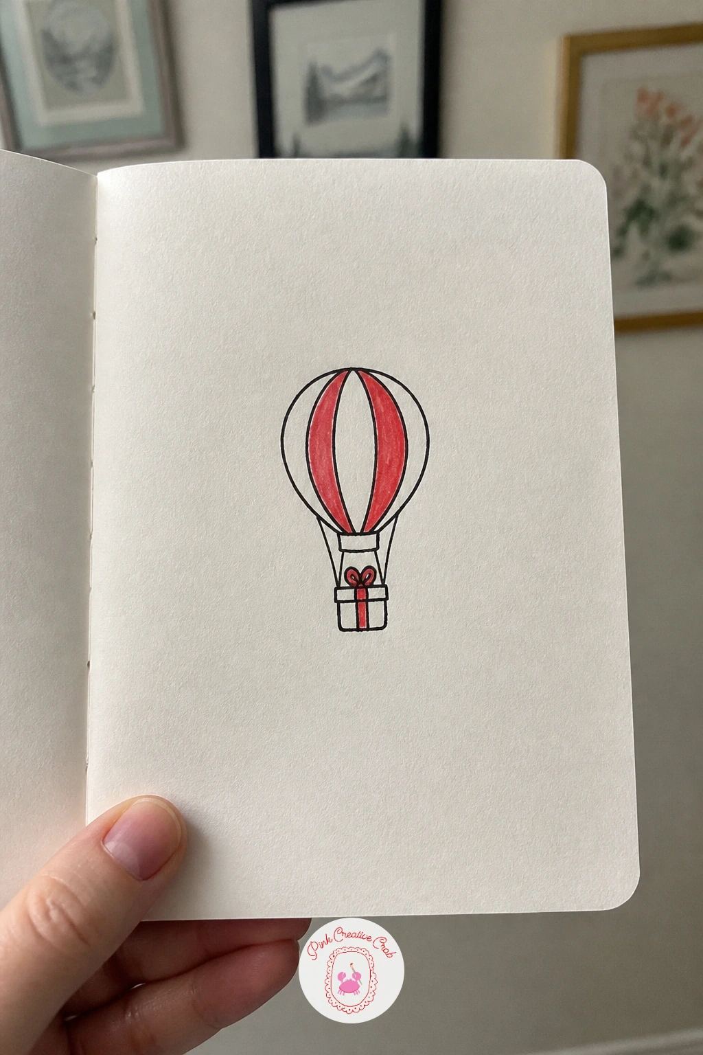 Hot Air Balloon With A Gift — Lift the scene off the ground with a hot air balloon carrying a small gift instead of a basket passenger. Simple christmas doodles