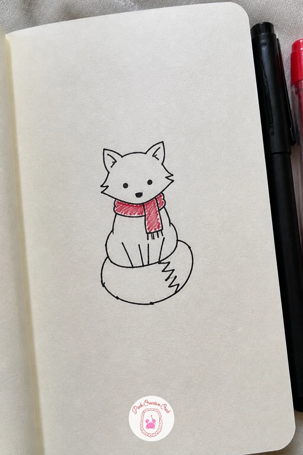 Fox In A Scarf — Keep the animal list going with a fox sitting upright, built from a rounded body, a pointed snout, and two tall triangle ears. Simple