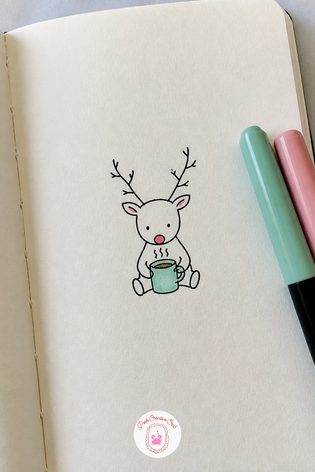 Reindeer Drinking Cocoa — Reindeer Drinking Cocoa pairs a gentle seated pose with a small prop that tells the whole story. Christmas drawing ideas easy doodles