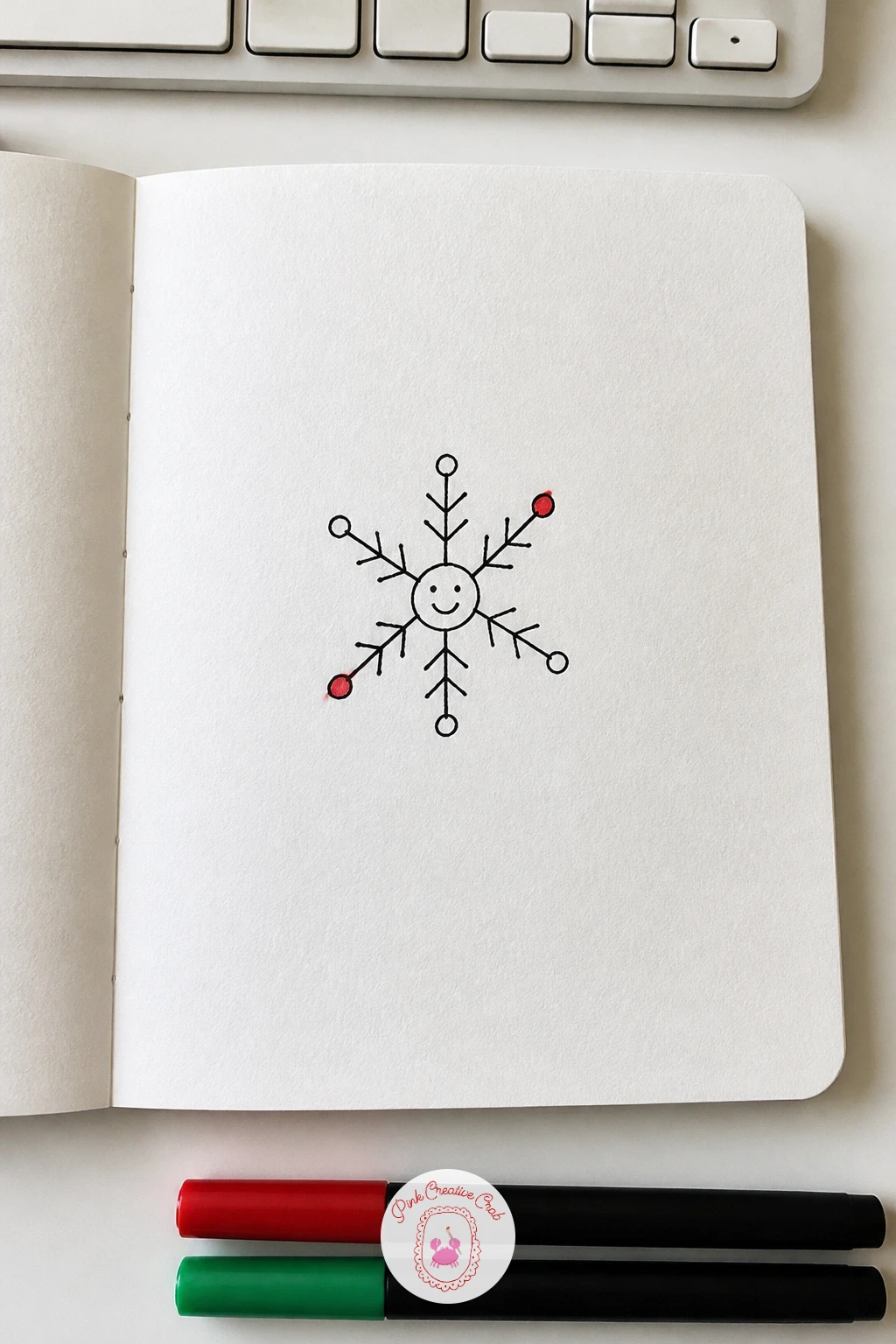 Snowflake With A Smiley — Start with the simplest doodle on the whole list: a snowflake with a smiley. Christmas card doodles
