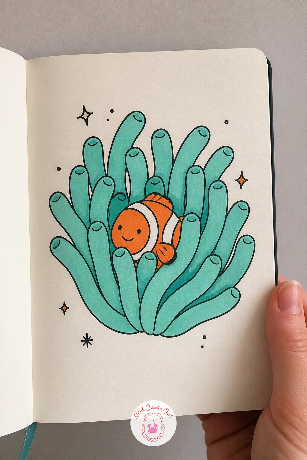 Clownfish In An Anemone — After two solo fish, give this one a home: a clownfish tucked into an anemone. Fish doodles