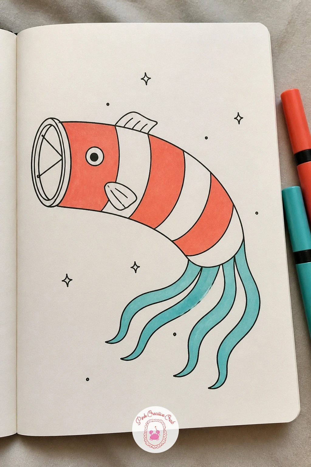 Fish Wind Sock — Borrow the shape of a garden wind sock for a fish that looks like it is caught mid-flutter in the breeze. Fish doodles