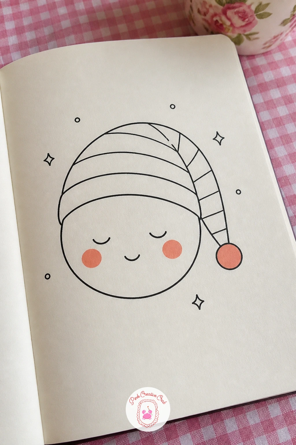 Sleepy Face With A Nightcap — Following on from the winking face, try a sleepy expression topped with a floppy nightcap and a pom-pom. Face doodles