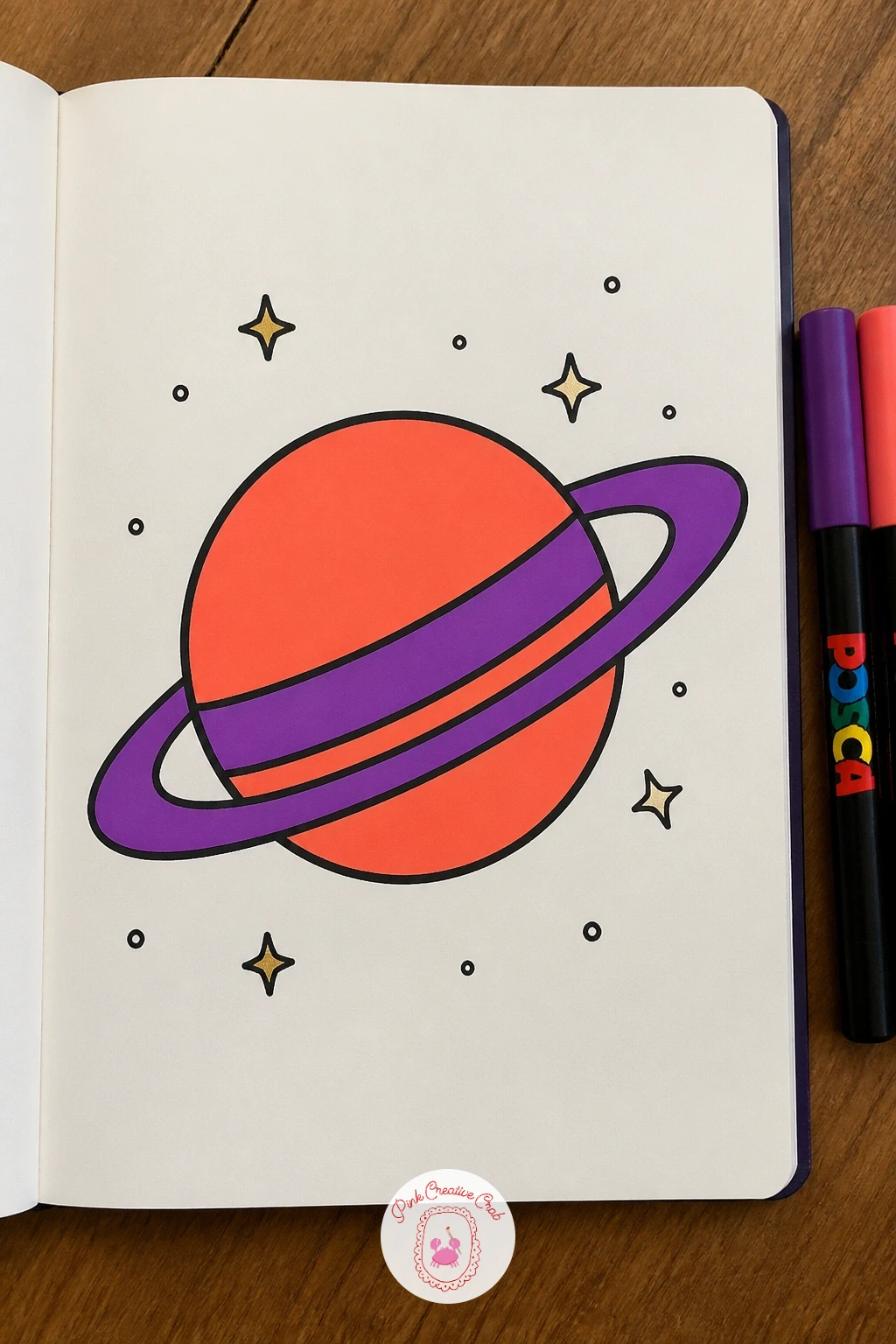 Planet With a Ring — Head into a small corner of outer space with a round planet circled by a tilted ring. Posca art doodle