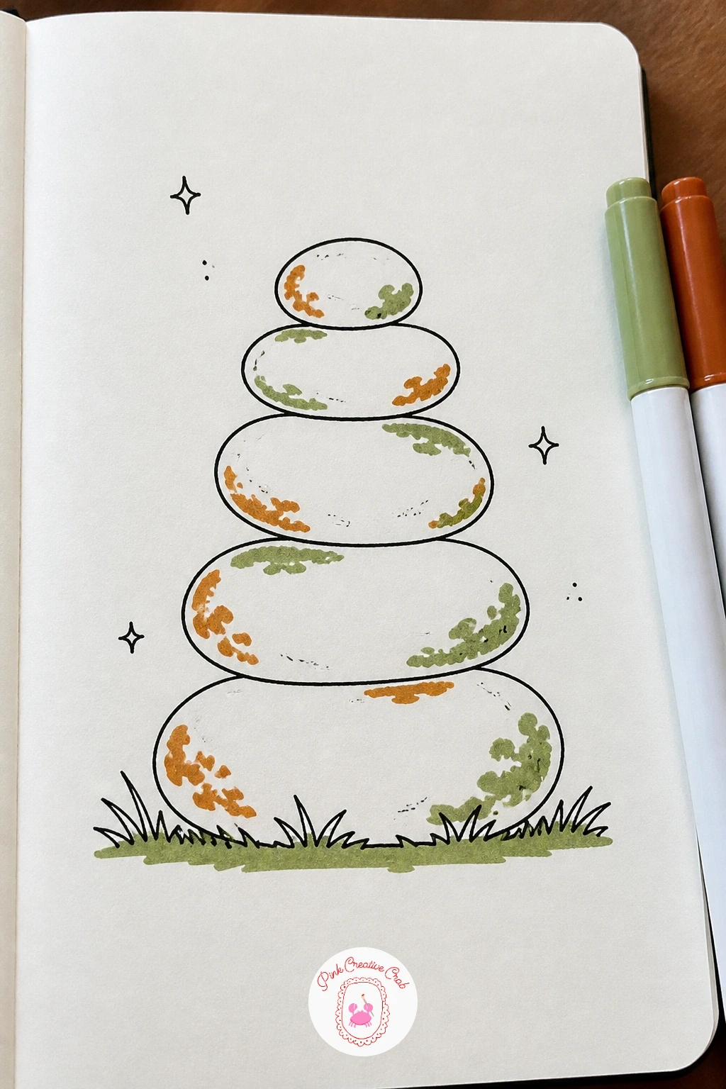 Pebble Stack — Balance is the whole game with a pebble stack, so look closely at how real stacked stones lean slightly off-center rather than sitting in a