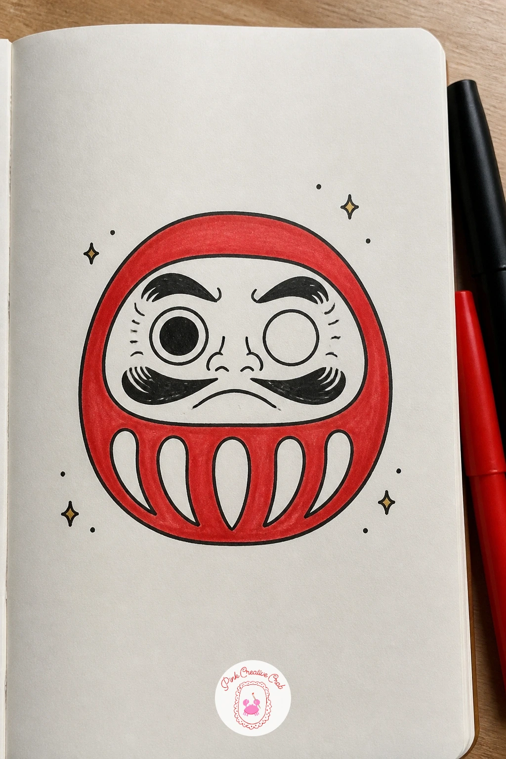 Daruma Doll With One Eye — The daruma doll borrows the same egg shape as the lantern but sits flatter and wider at the base. Japanese doodles