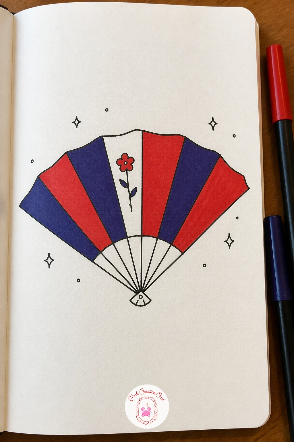 Open Folding Fan — The folding fan is a satisfying shape to draw with a ruler-free radiating line trick: mark a center point at the bottom, then fan out six or
