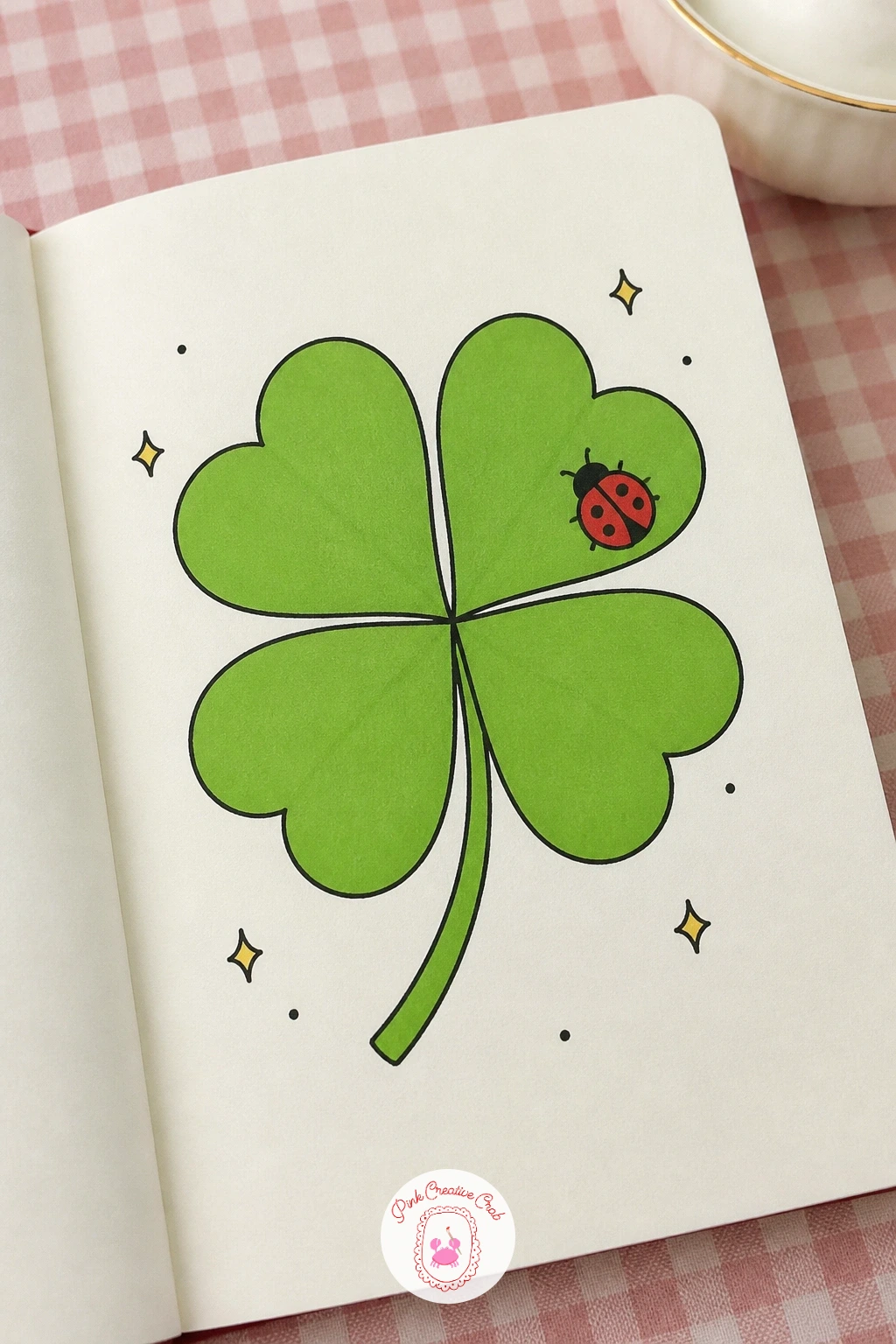 Four Leaf Clover With a Ladybird — Move from flowers to luck with a four leaf clover, drawn as four overlapping heart shapes meeting at a center point. March
