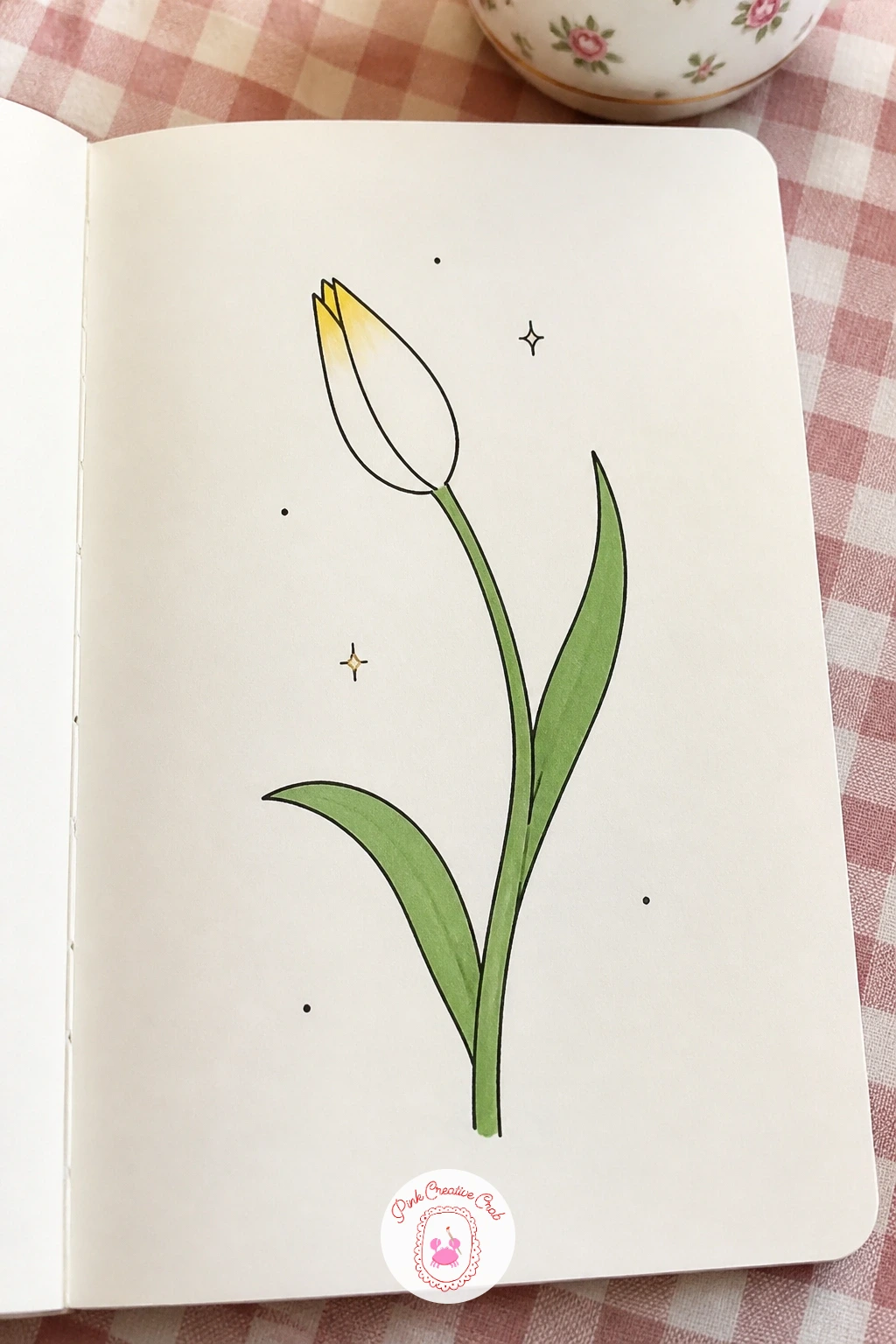 Tulip Bud — Isolate just one tulip bud, tightly closed and leaning slightly to one side, a calm little subject that takes only a few lines. March doodles