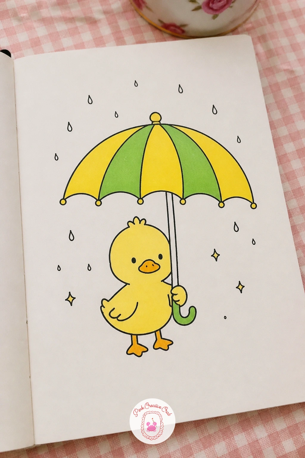 Umbrella Sheltering a Duckling — Return to a gentler pace with a small umbrella held up over a single duckling caught in a light spring shower. March doodles