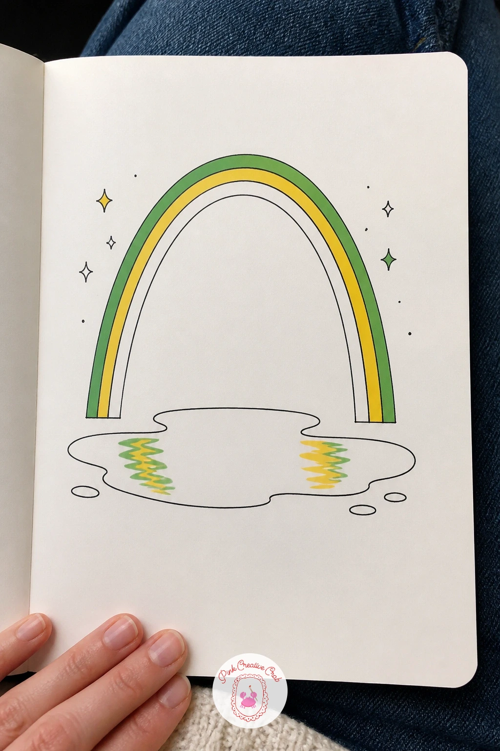 Rainbow Over a Puddle — Echo that rainbow idea from a different angle with a rainbow arching over a simple puddle on the ground, its colors faintly reflected