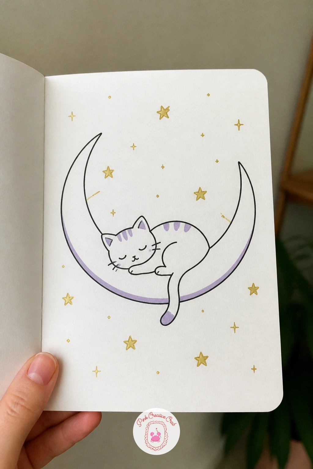 Cat Sleeping On A Crescent Moon — Build on the nightcap moon from earlier by giving this crescent a passenger instead of a hat. Celestial doodles