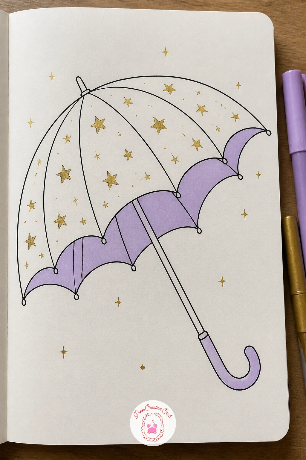 Starry Umbrella — Take a familiar everyday object and give it a night sky instead of rain this time. Celestial doodles