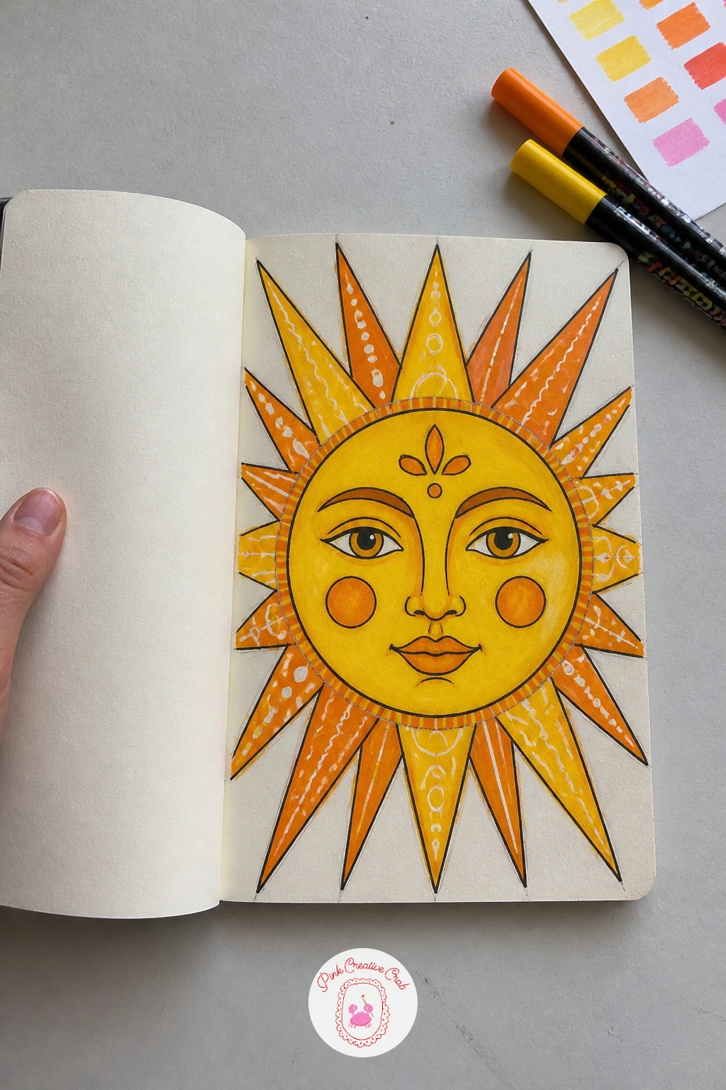 Bold Sun Face Cover — A bold sun face plants one big friendly face in the center of the cover, radiating triangular rays all the way to the edges, so the whole