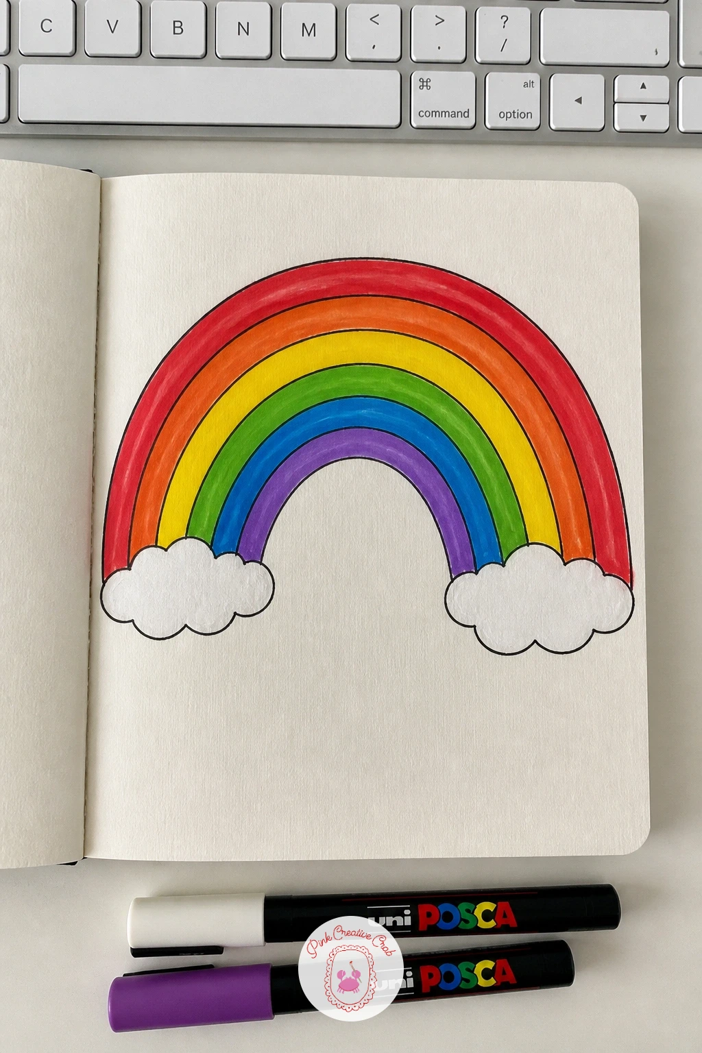 Rainbow Arch Cover — A rainbow arch sweeps across the upper half of the cover in even bands of color, with a bit of soft cloud or ground detail tucked at each