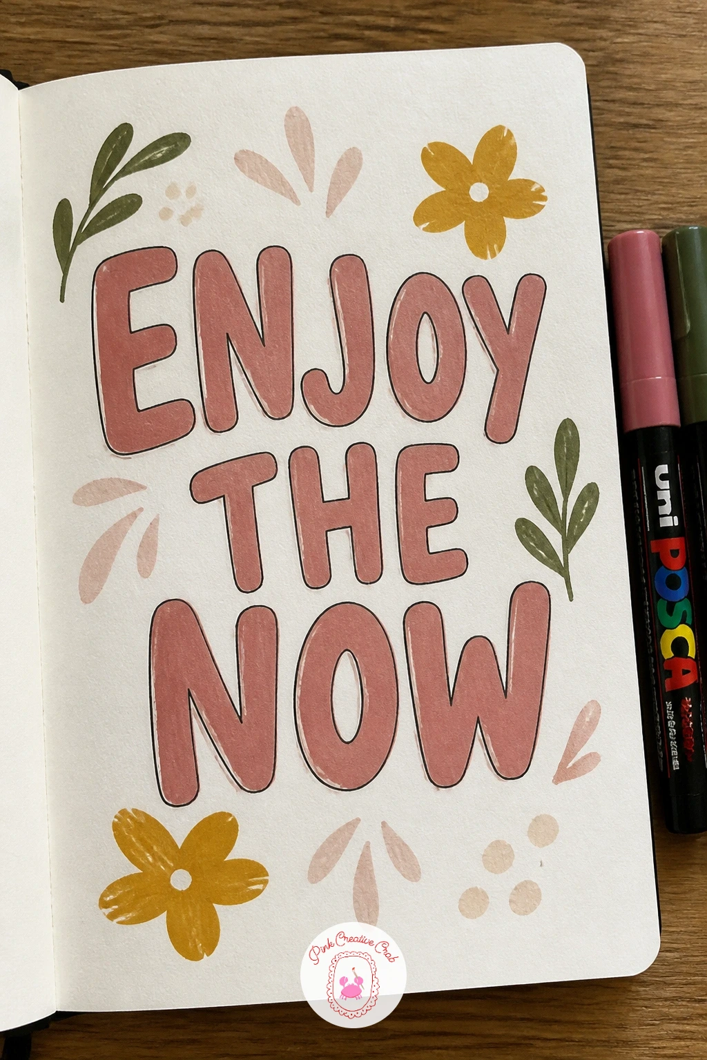 Hand-Lettered Quote Cover — A hand-lettered quote turns the cover into a message you will see every time you reach for the book, built from a short line of