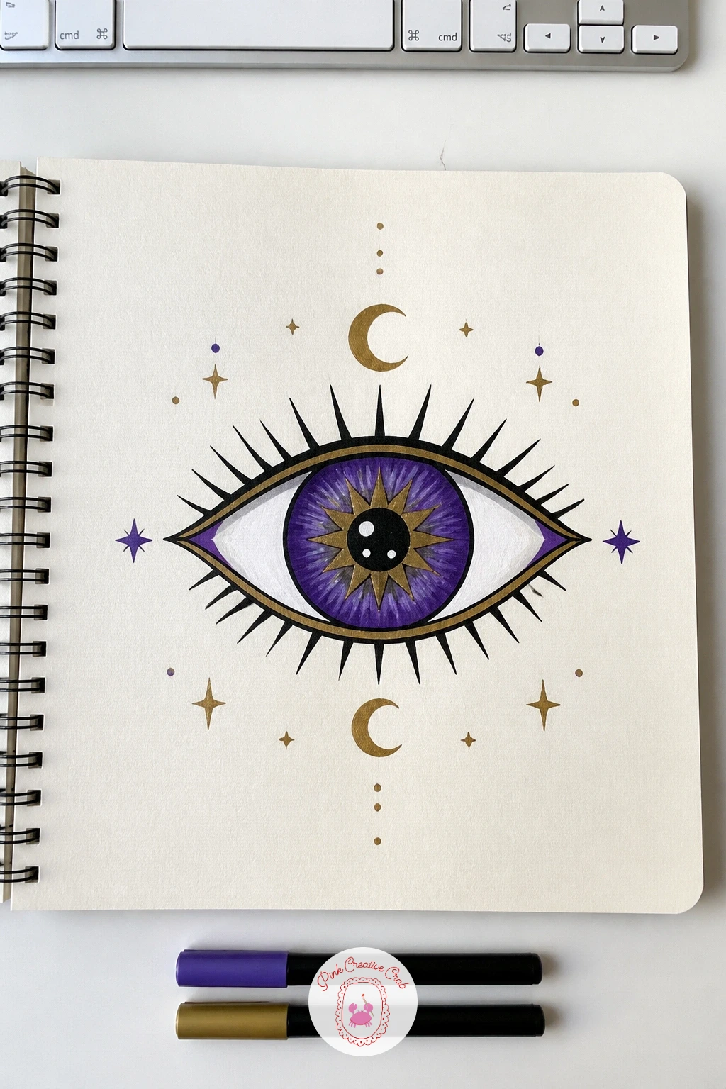 Celestial Eye Cover — A celestial eye makes a striking centerpiece, one large stylized eye shape with stars, a crescent moon and small dots filling the space