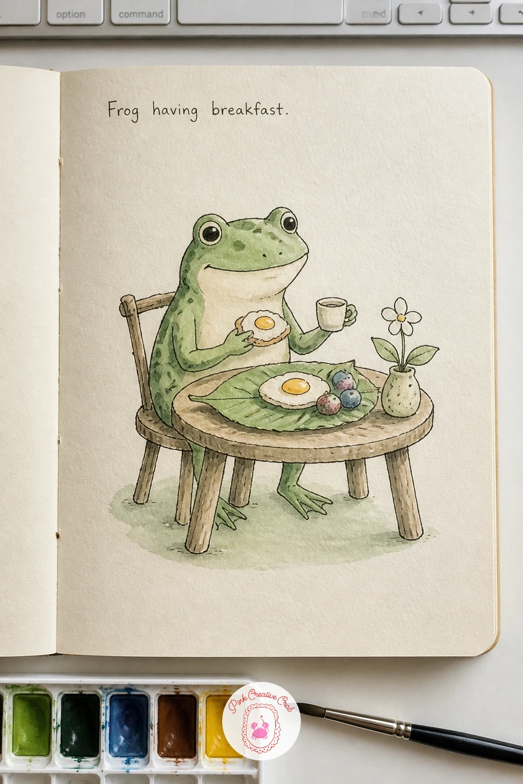 Frog Having Breakfast — A frog having breakfast brings a little humor into the sketchbook, sitting a frog upright at a tiny table with a leaf for a plate.