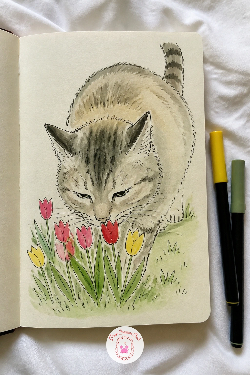 Cat Sniffing a Field of Tulips — Give a cat a whole field of tulips to sniff the way it would investigate one flower on a windowsill, nose pressed down close