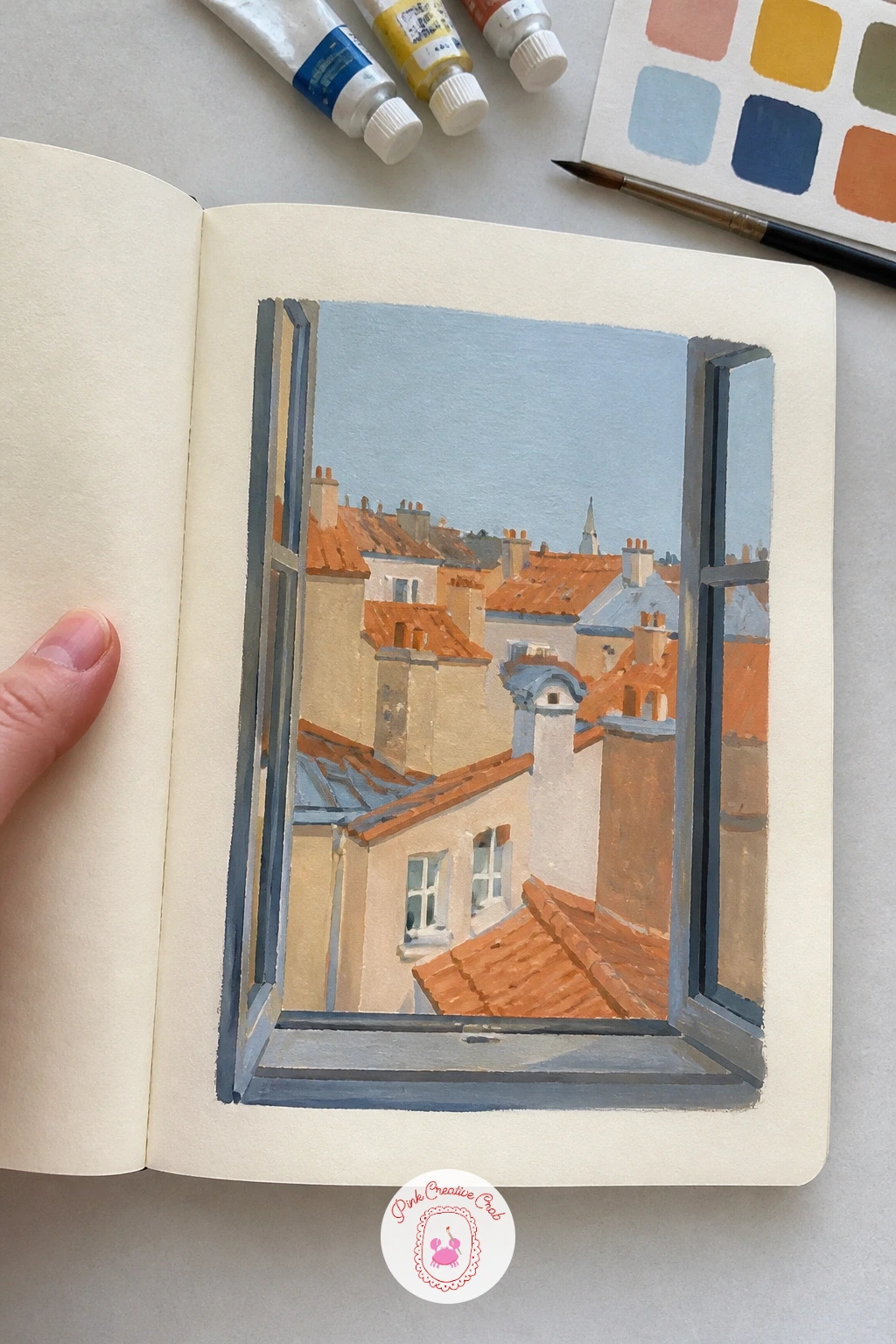 Window View Over Rooftops — Give yourself more air to work with on the next page: a window view over rooftops. Gouache sketchbook