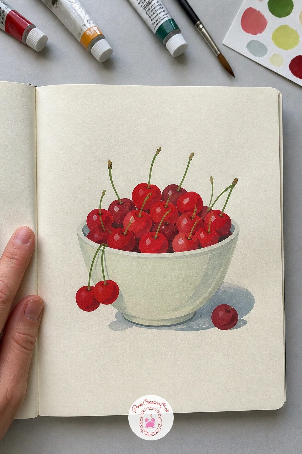 A Bowl Of Cherries — Bring some red onto the page with a bowl of cherries, a quick, cheerful still life that rewards a loaded brush. Gouache sketchbook
