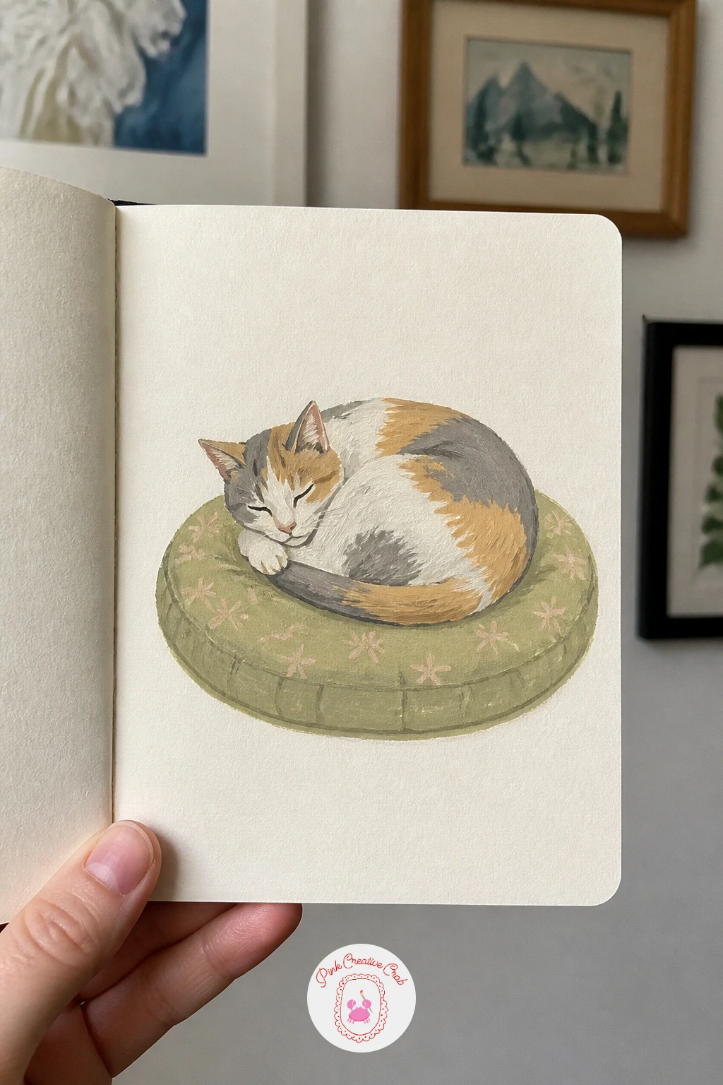 Tiny Portrait Of A Cat On A Cushion — Slow right down for a tiny portrait of a cat on a cushion, one of the gentlest pages in the book. Gouache sketchbook