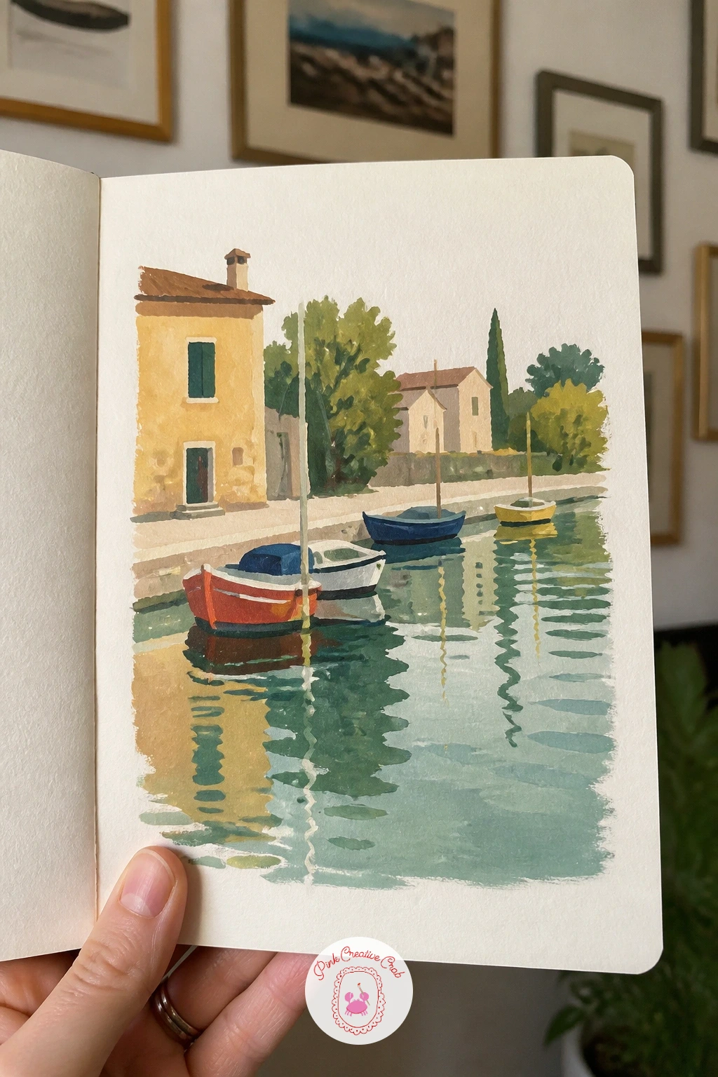 Canal With Moored Boats — Settle into a quieter scene after that busy sky page: a canal with moored boats, their reflections doubling the color on the page.