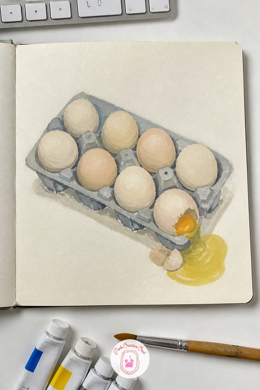 Eggs In A Carton With One Cracked — Finish the sketchbook with a page of eggs in a carton, one cracked, a small still life that teaches shape and shadow in one