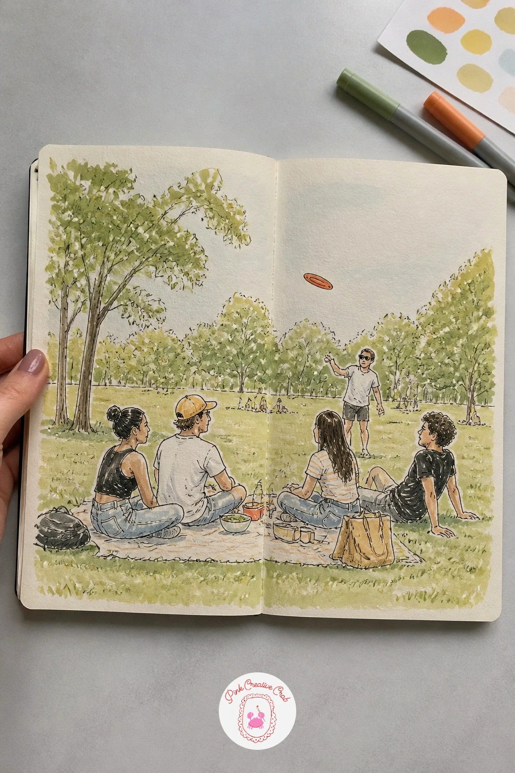 Park Picnic With a Frisbee — Spread a blanket out for a park picnic page, a frisbee caught mid-flight above the group. Sketchbook inspiration