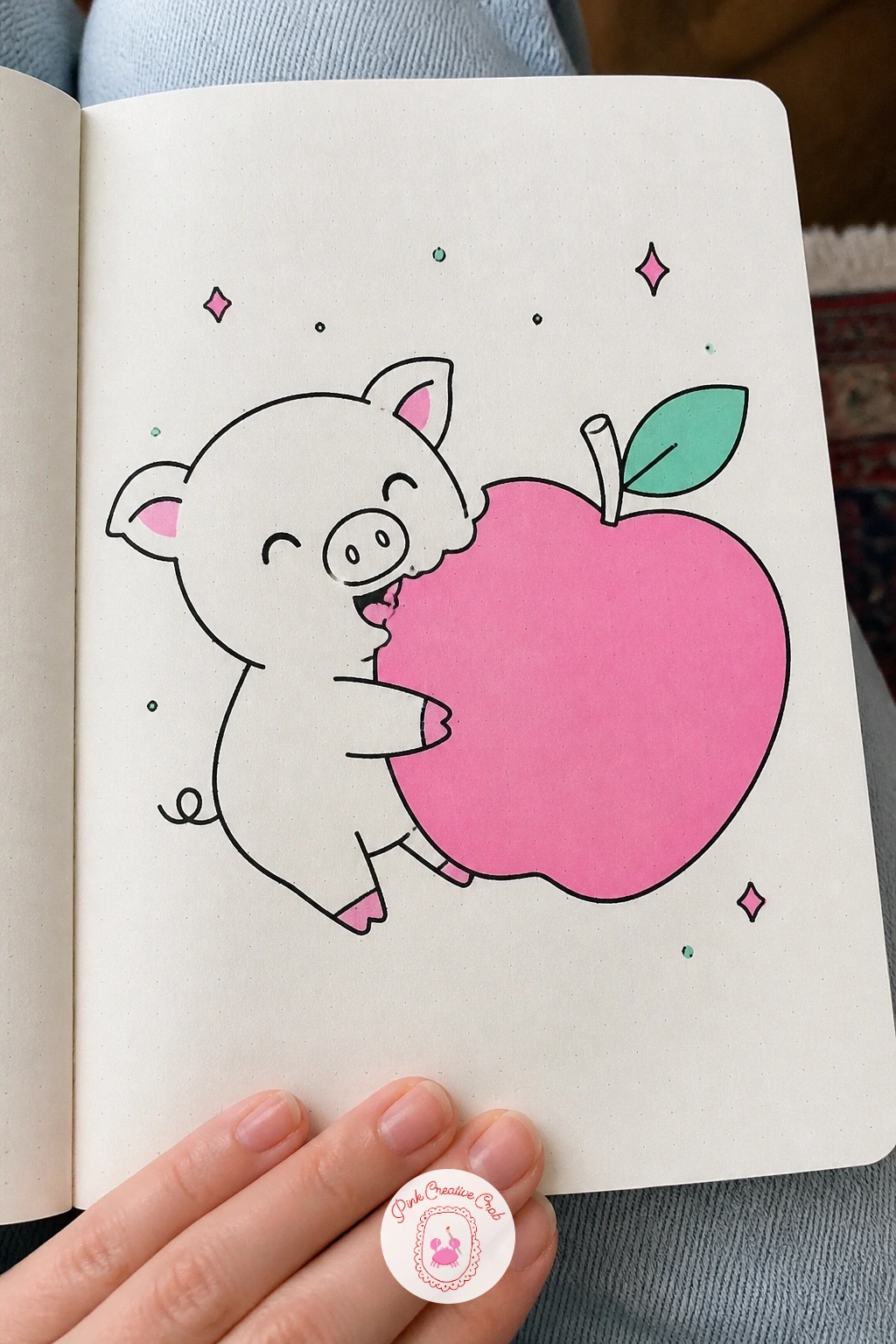 Pig Eating a Big Apple — Scale is the fun part of this one: draw the apple noticeably larger than the pig's own head, almost too big to hold, and the whole