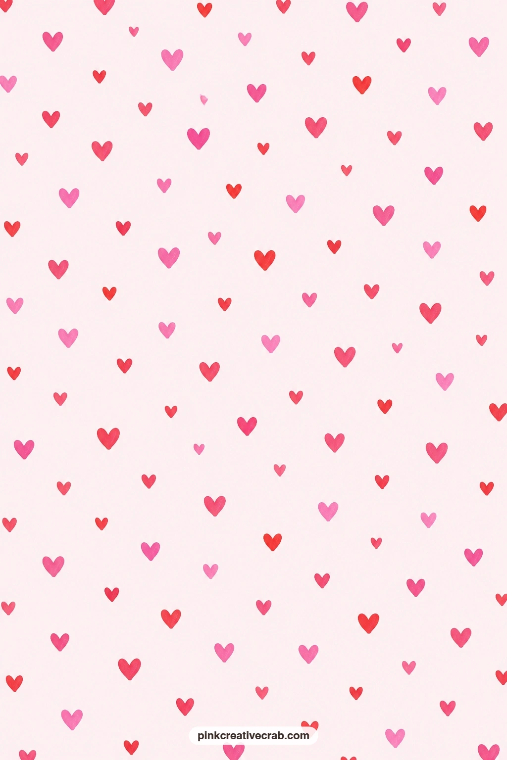 Scattered Sweetheart Paper printable page — Small red and pink hearts scatter loose across a pale pink ground, light enough to sit under a photo on a Valentine