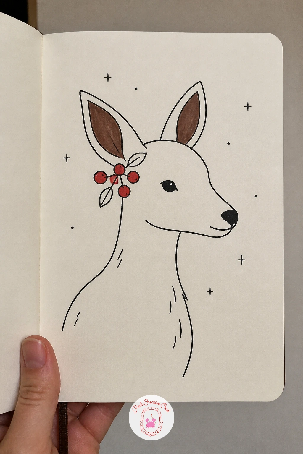 Deer With Berries Behind Its Ear — Draw a deer's head and shoulders with a small sprig of berries tucked behind one ear, a quiet and quick portrait style