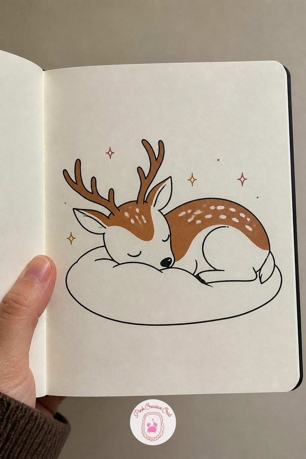 Deer Asleep On A Snow Pillow — Draw a deer lying down, head resting on a soft raised mound of snow shaped roughly like a pillow. Deer doodle